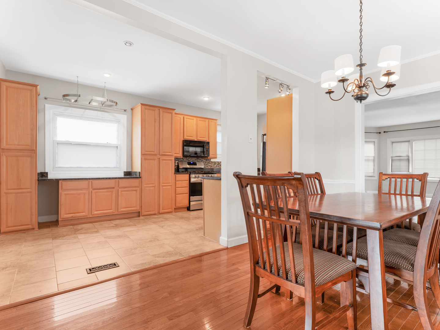 3439 West 66th Place Chicago, IL 60629 - Photo 9 of 31 a view of a dining room with furniture window and wooden floor