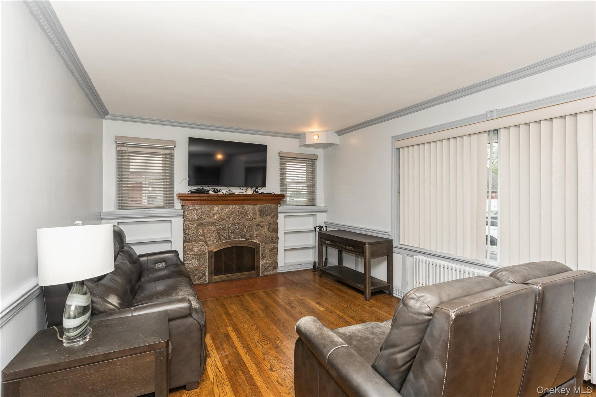 6 Jasper Street Valley Stream, NY 11580 - Photo 3 of 19 a living room with furniture and a fireplace