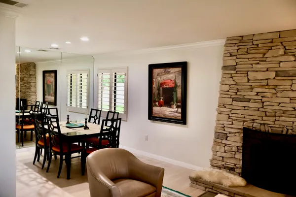 a view of a dining room with furniture and window