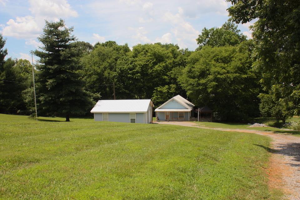 2734 Battle Creek Road Springfield, TN 37172 - Photo 1 of 8 a house with a yard and trees