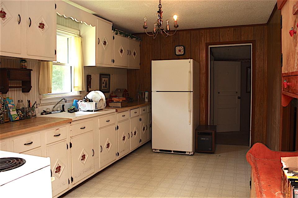 2734 Battle Creek Road Springfield, TN 37172 - Photo 6 of 8 a kitchen with sink a refrigerator and a stove