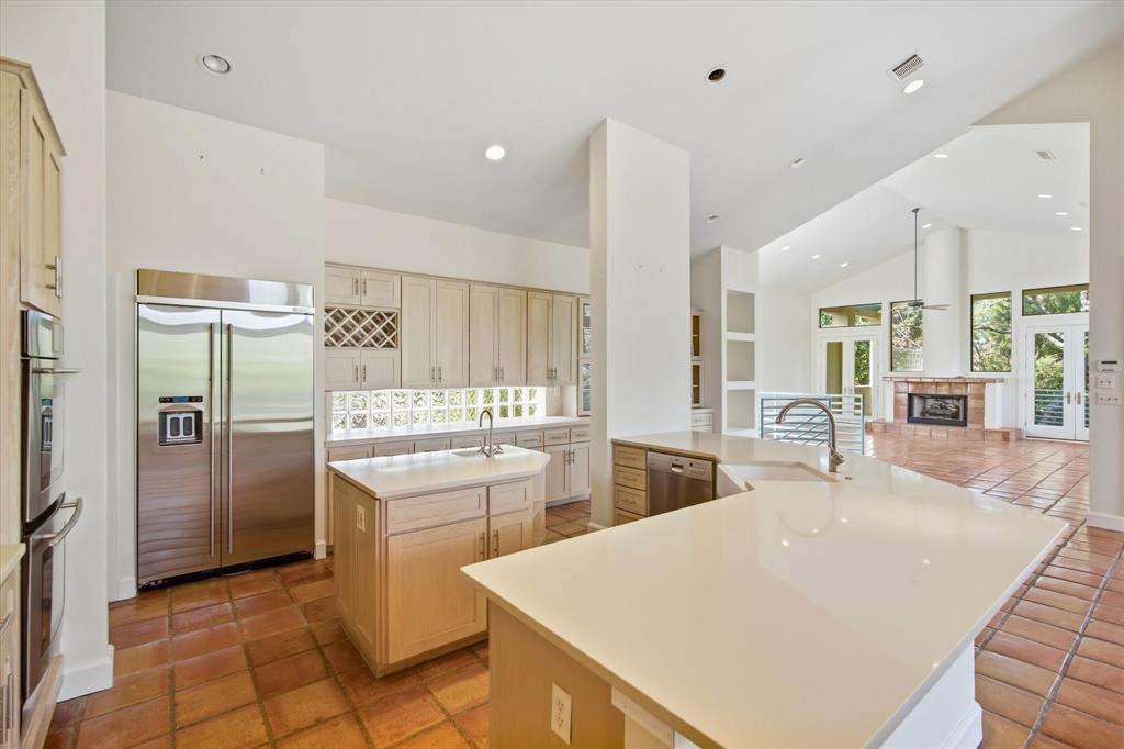 3606 Labrador Grapevine, TX 76051 - Photo 21 of 38 Spacious kitchen with a center island, extensive light-toned cabinetry, and stainless steel appliances