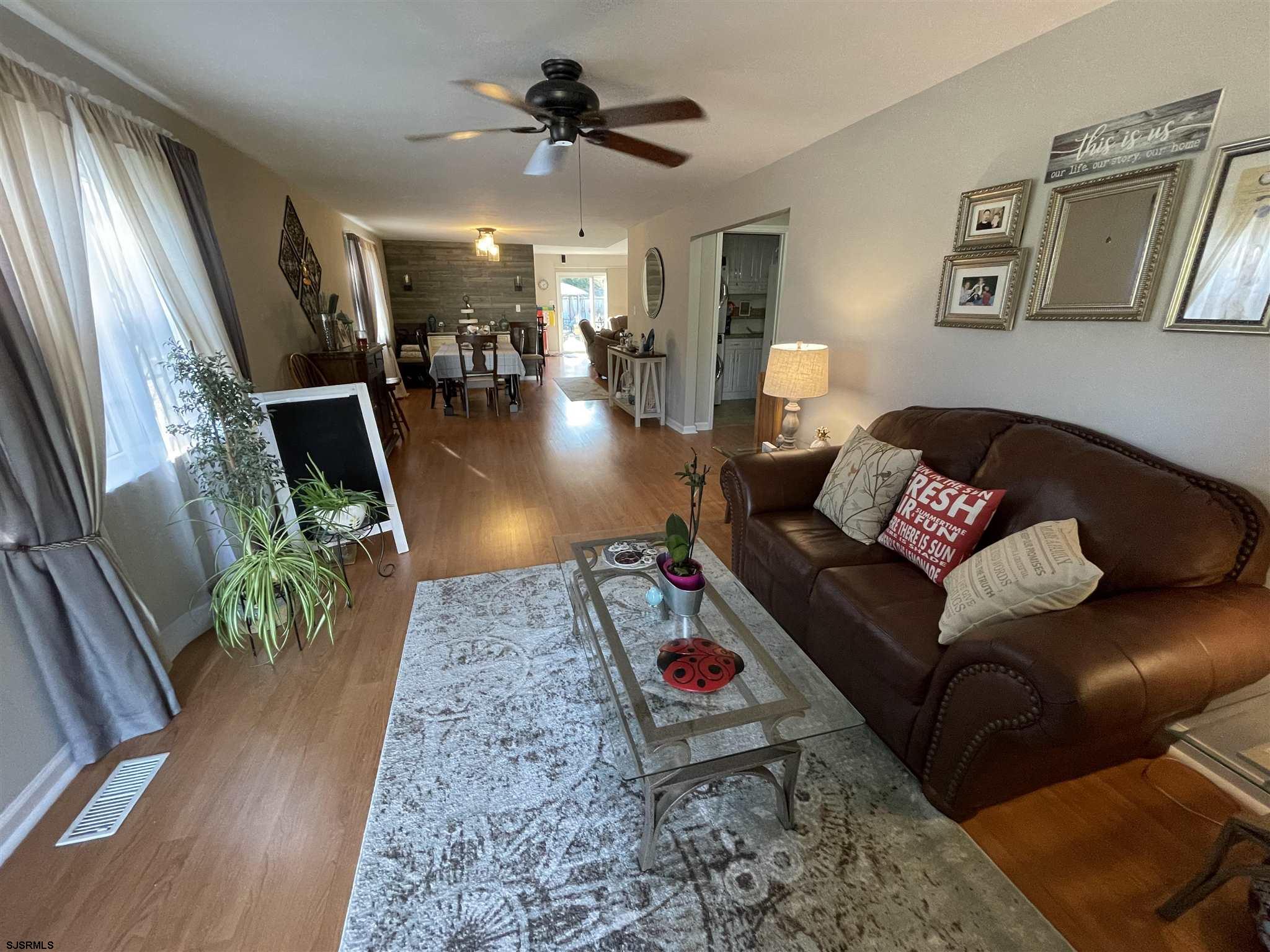 333 Shore Road Somers Point, NJ 08244 - Photo 2 of 25 a living room with furniture and a wooden floor