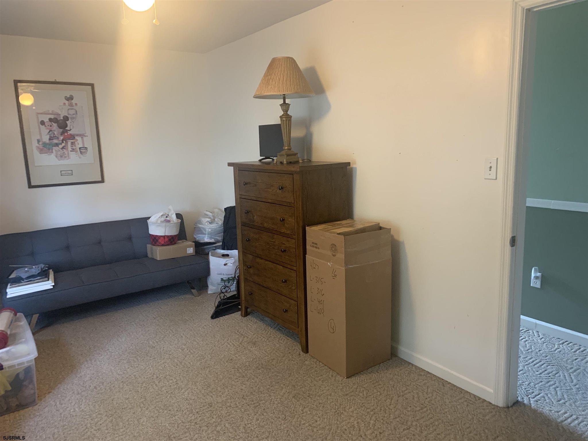 333 Shore Road Somers Point, NJ 08244 - Photo 15 of 25 a living room with furniture and a lamp