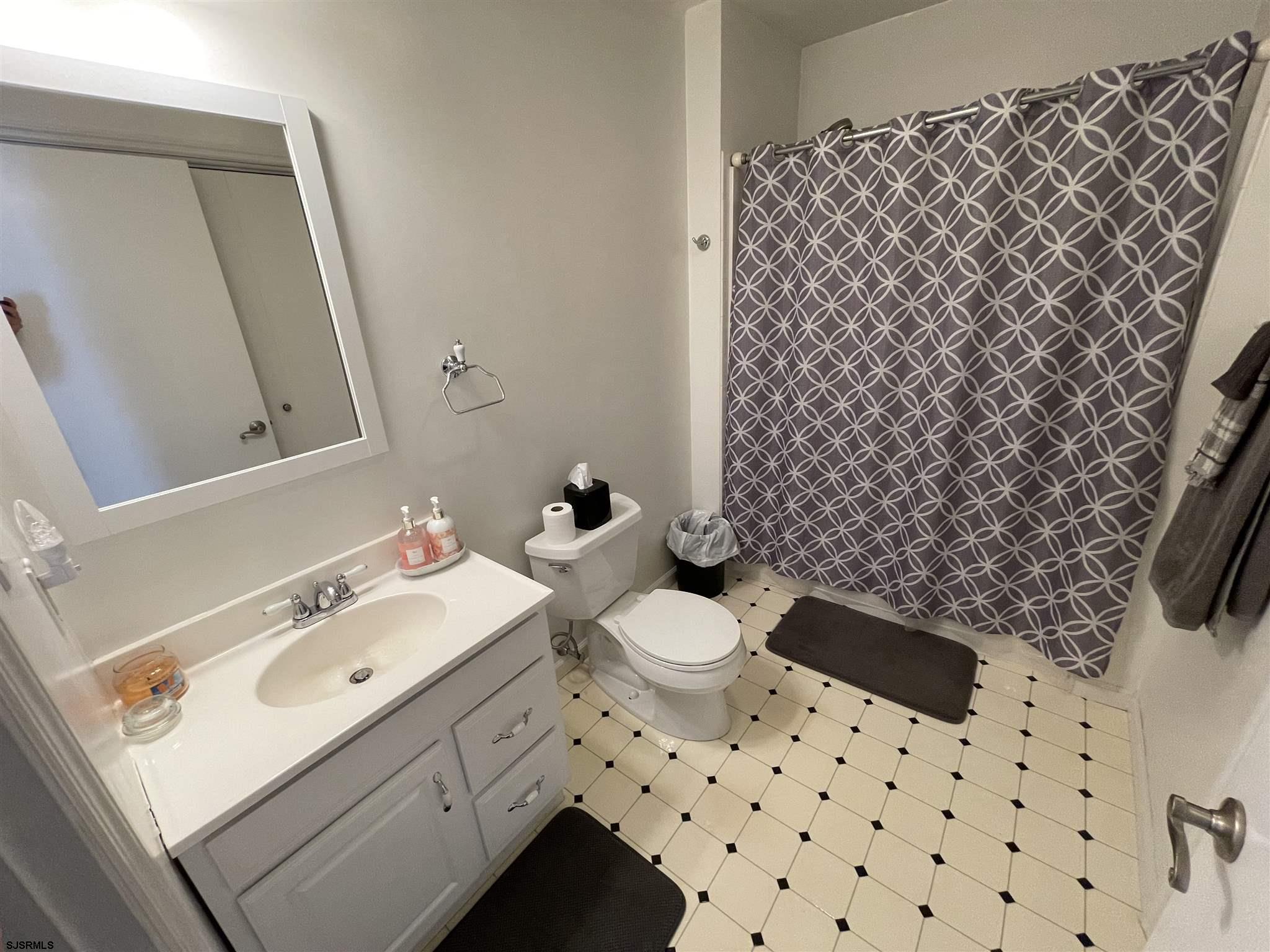 333 Shore Road Somers Point, NJ 08244 - Photo 17 of 25 a bathroom with a sink toilet and shower