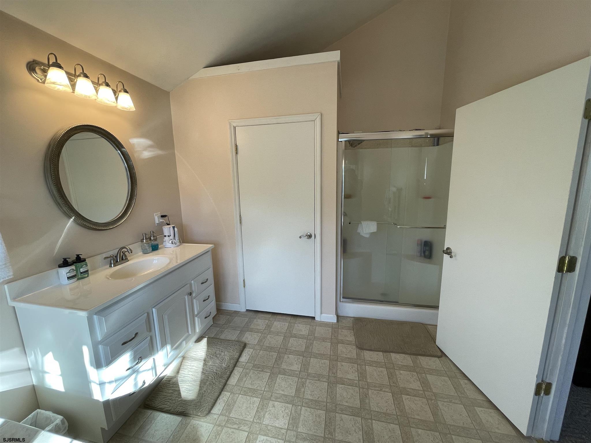 333 Shore Road Somers Point, NJ 08244 - Photo 20 of 25 a bathroom with a sink a toilet and shower