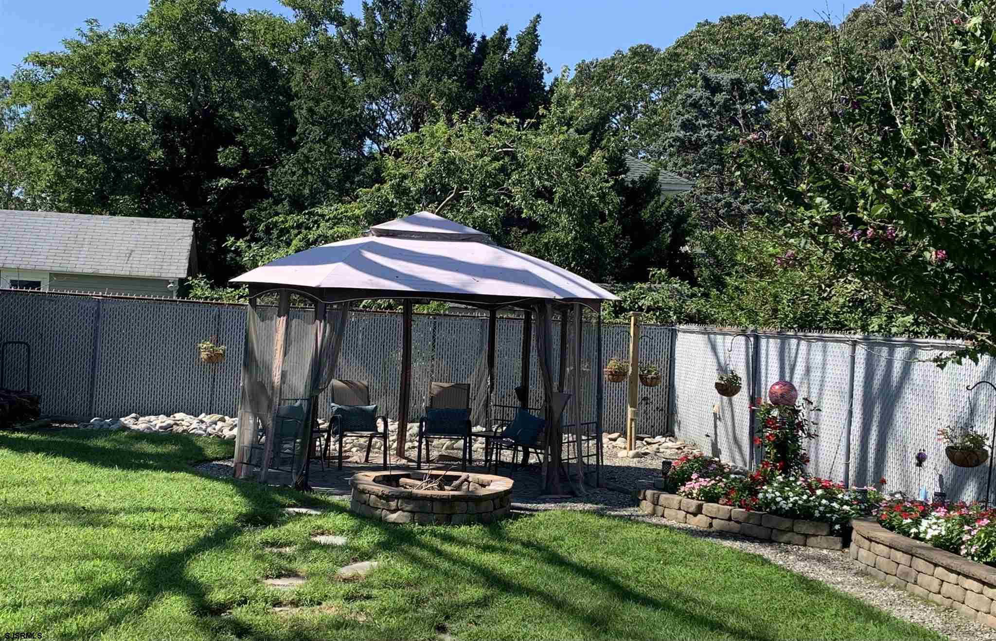 333 Shore Road Somers Point, NJ 08244 - Photo 22 of 25 a view of backyard with deck and garden