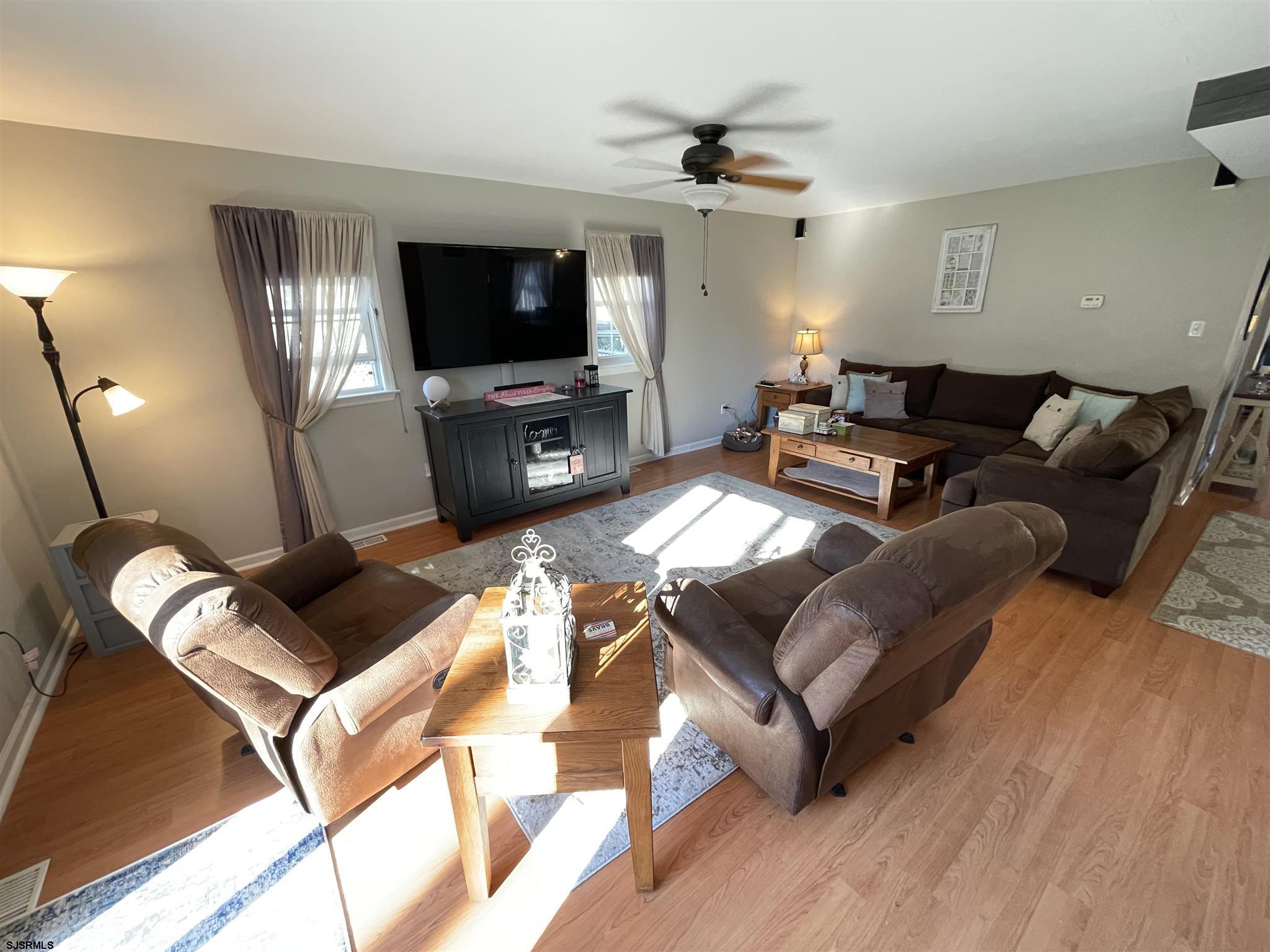 333 Shore Road Somers Point, NJ 08244 - Photo 4 of 25 a living room with furniture and a flat screen tv