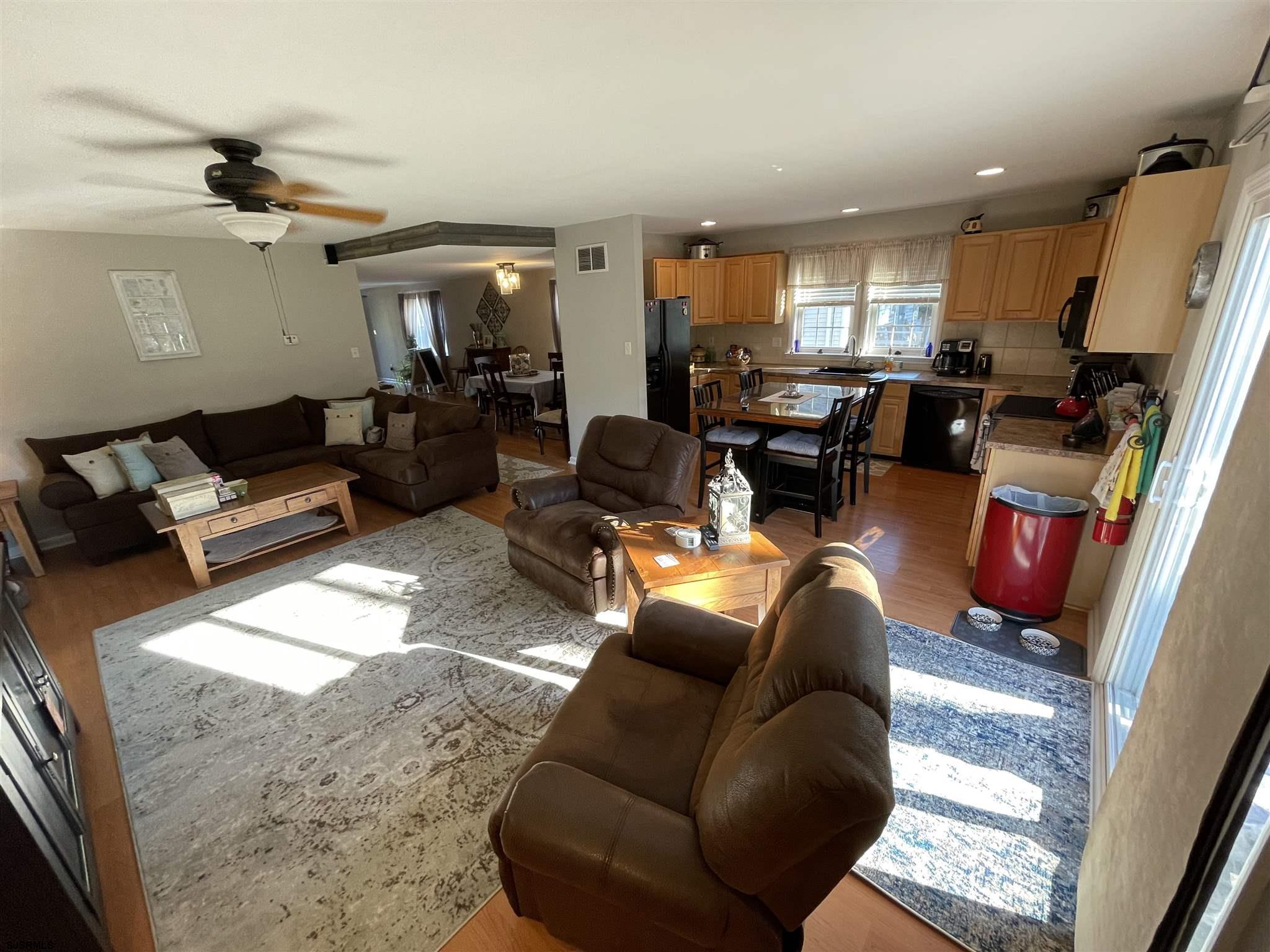 333 Shore Road Somers Point, NJ 08244 - Photo 5 of 25 a living room with furniture and a flat screen tv
