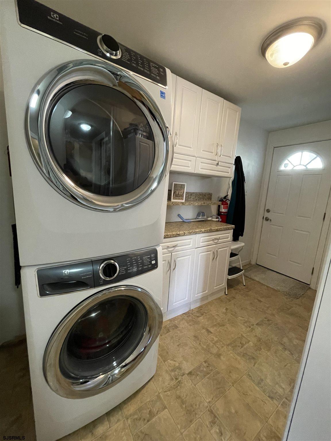 333 Shore Road Somers Point, NJ 08244 - Photo 9 of 25 a utility room with sink dryer and washer