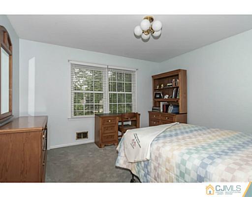 14 Fox Hill Road Edison, NJ 08820 - Photo 11 of 22 a bedroom with a bed and a window