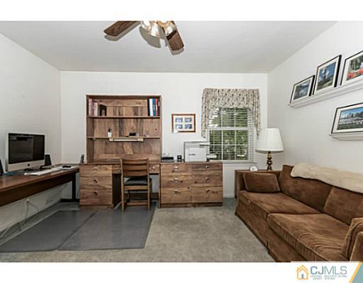 14 Fox Hill Road Edison, NJ 08820 - Photo 13 of 22 a living room with furniture and a flat screen tv