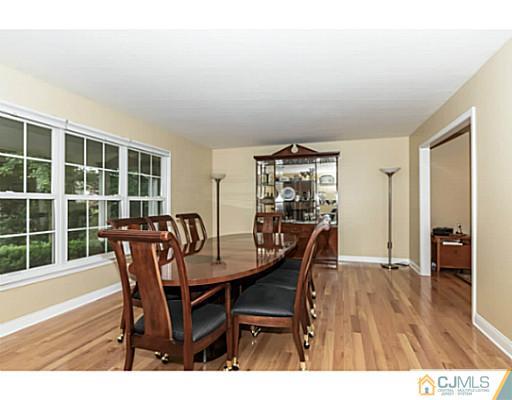 14 Fox Hill Road Edison, NJ 08820 - Photo 3 of 22 a view of a dining room with furniture and wooden floor