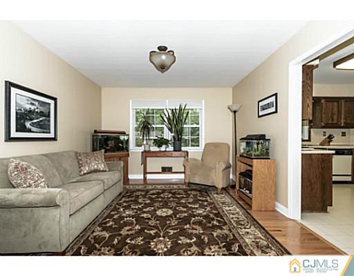 14 Fox Hill Road Edison, NJ 08820 - Photo 5 of 22 a living room with furniture and a flat screen tv