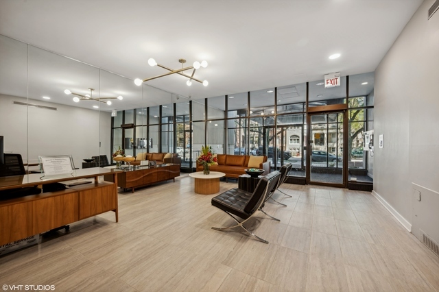 2728 North Hampden Court, Unit 1310 Chicago, IL 60614 - Photo 14 of 15 a living room with furniture a flat screen tv and a table