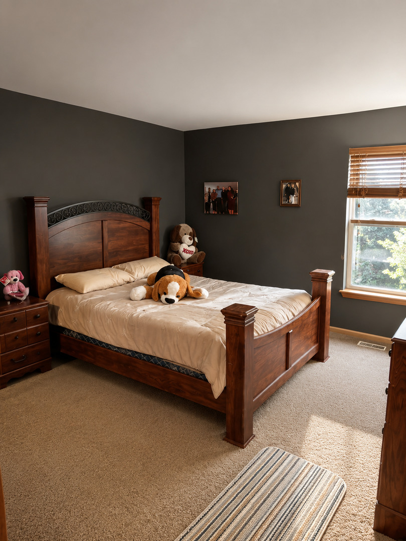 720 Ridge Drive Marengo, IL 60152 - Photo 25 of 34 a bedroom with a bed and window