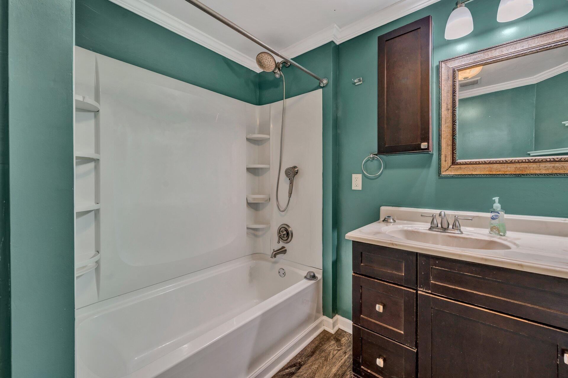8342 Goodview Road Goodview, VA 24095 - Photo 20 of 30 a bathroom with a sink and a mirror