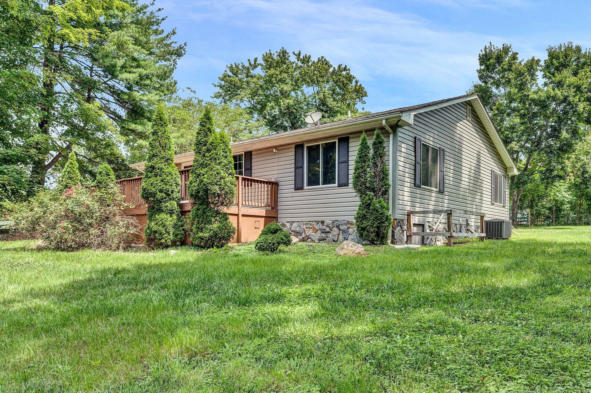 8342 Goodview Road Goodview, VA 24095 - Photo 3 of 30 a front view of house with yard and green space