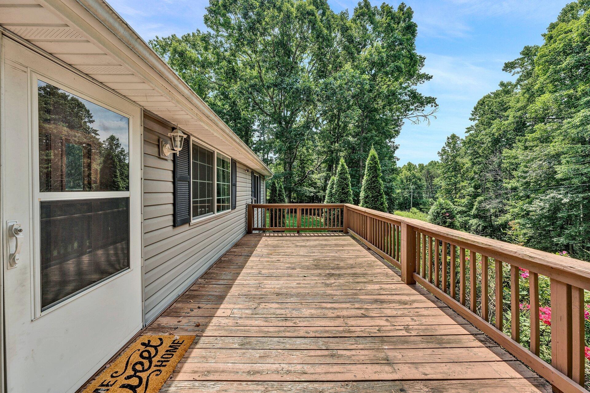 8342 Goodview Road Goodview, VA 24095 - Photo 4 of 30 a view of balcony with wooden floor and fence