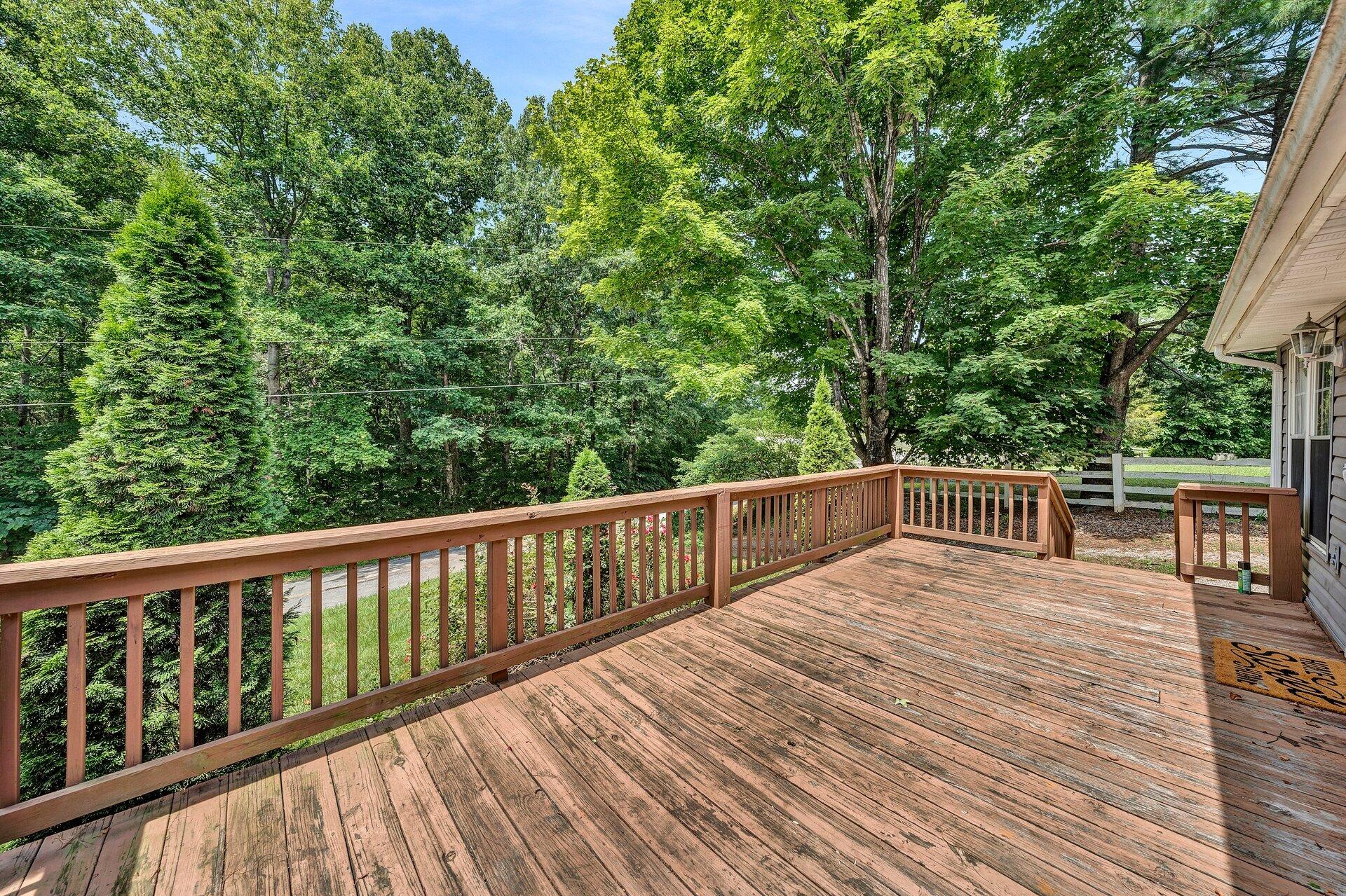 8342 Goodview Road Goodview, VA 24095 - Photo 5 of 30 a balcony with wooden floor and fence