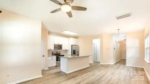 a view of a kitchen with a sink and dishwasher