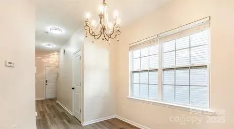 a view of a hallway with a chandelier