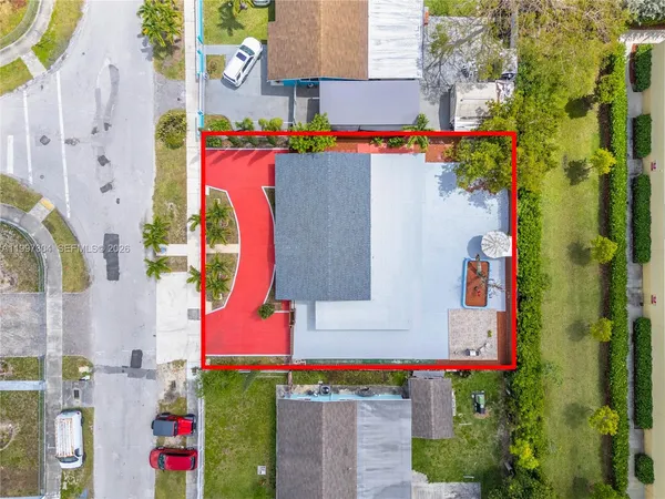 an aerial view of residential houses and outdoor space