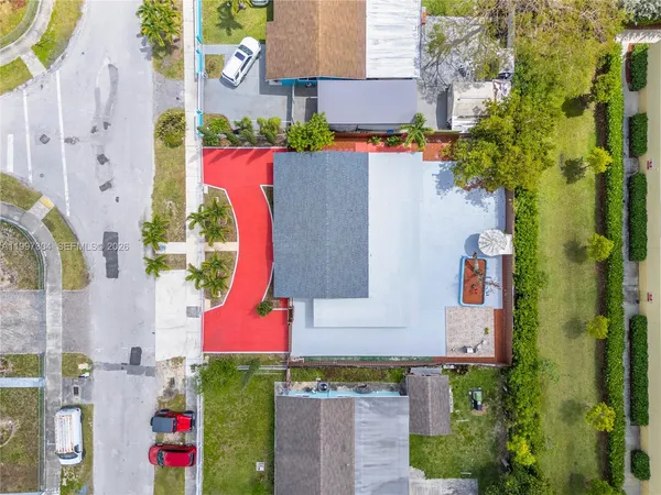 an aerial view of residential houses with outdoor space