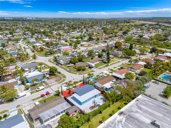 an aerial view of residential houses with outdoor space