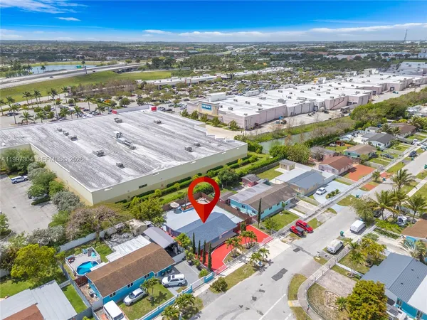 an aerial view of residential building and lake