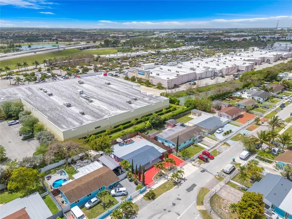 an aerial view of residential houses with outdoor space