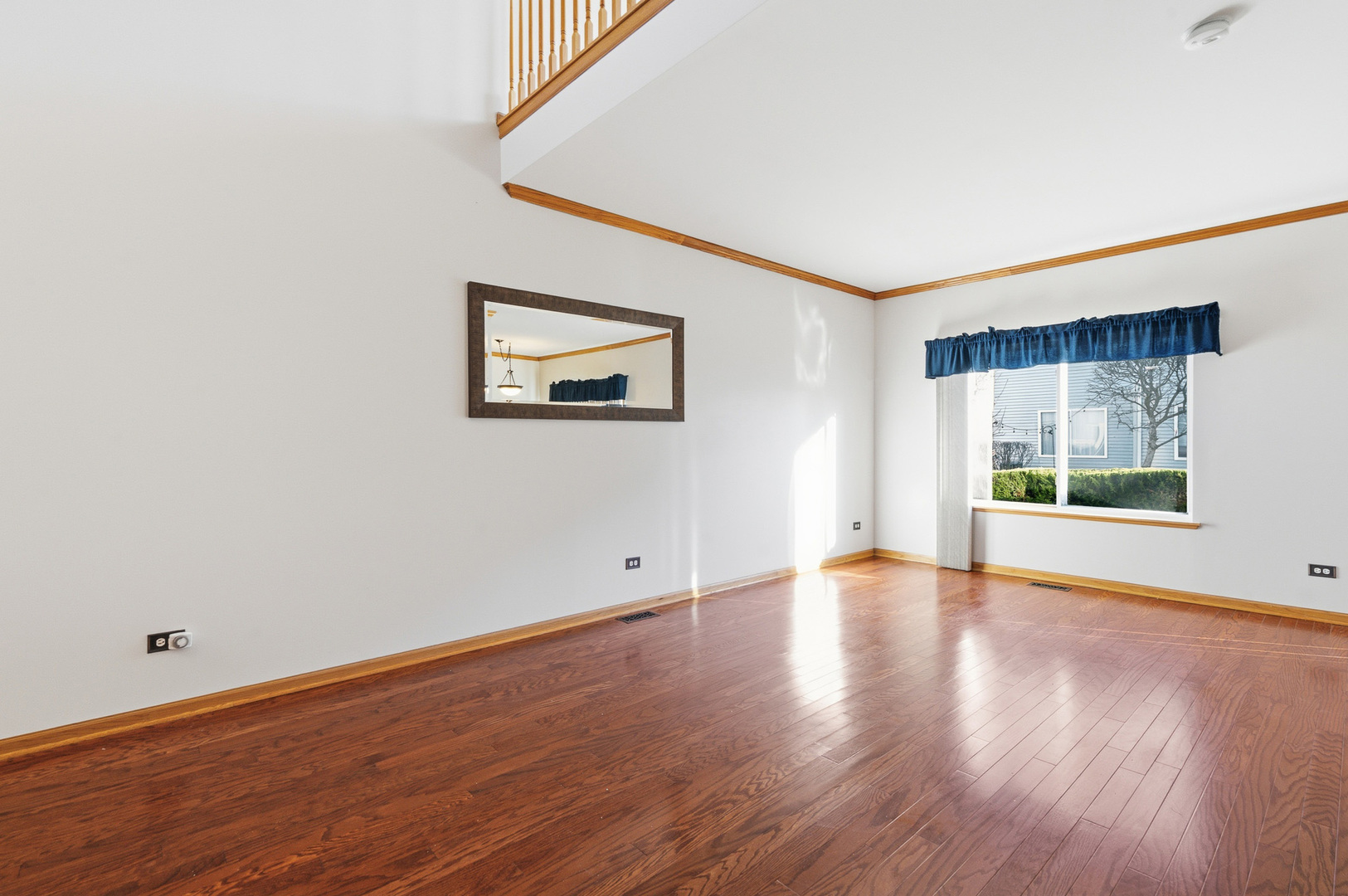 17656 Gilbert Drive Lockport, IL 60441 - Photo 14 of 32 a view of an empty room with wooden floor and a window