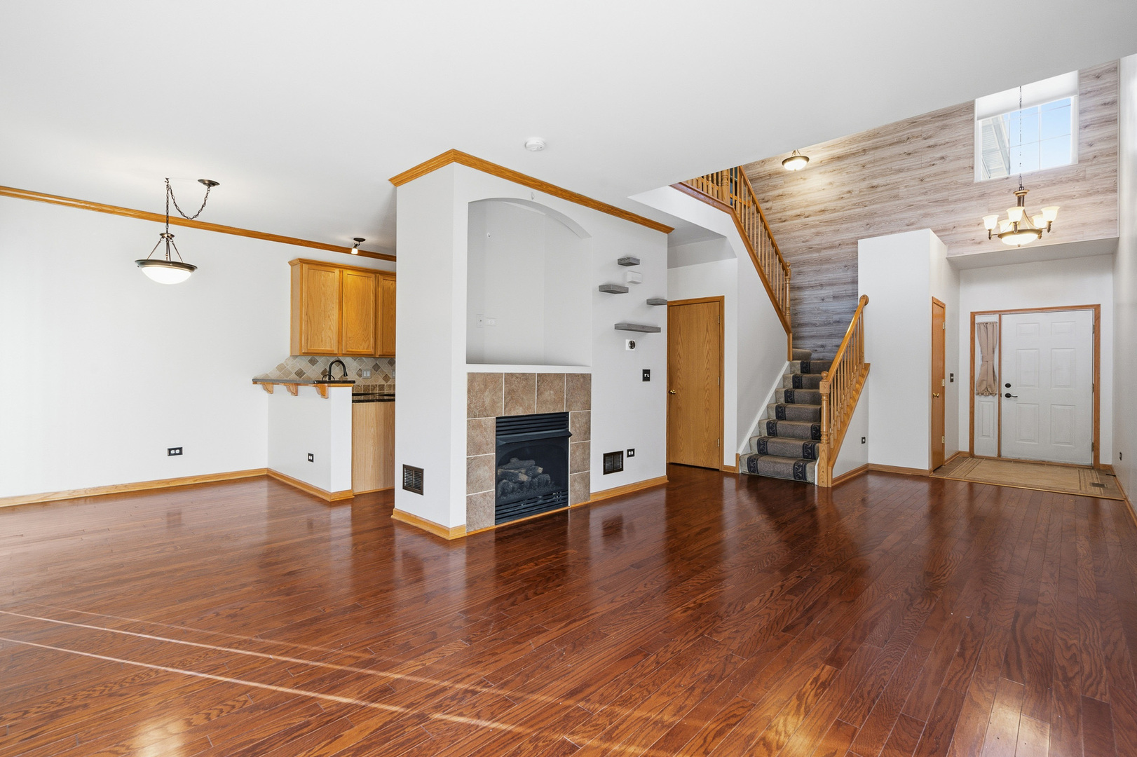 17656 Gilbert Drive Lockport, IL 60441 - Photo 15 of 32 a view of a livingroom with wooden floor and a fireplace