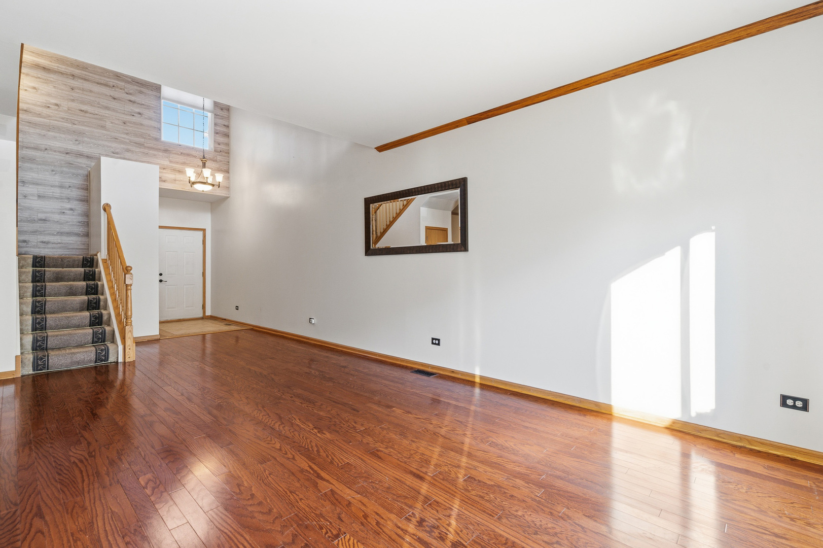 17656 Gilbert Drive Lockport, IL 60441 - Photo 16 of 32 a view of an empty room with wooden floor and a window