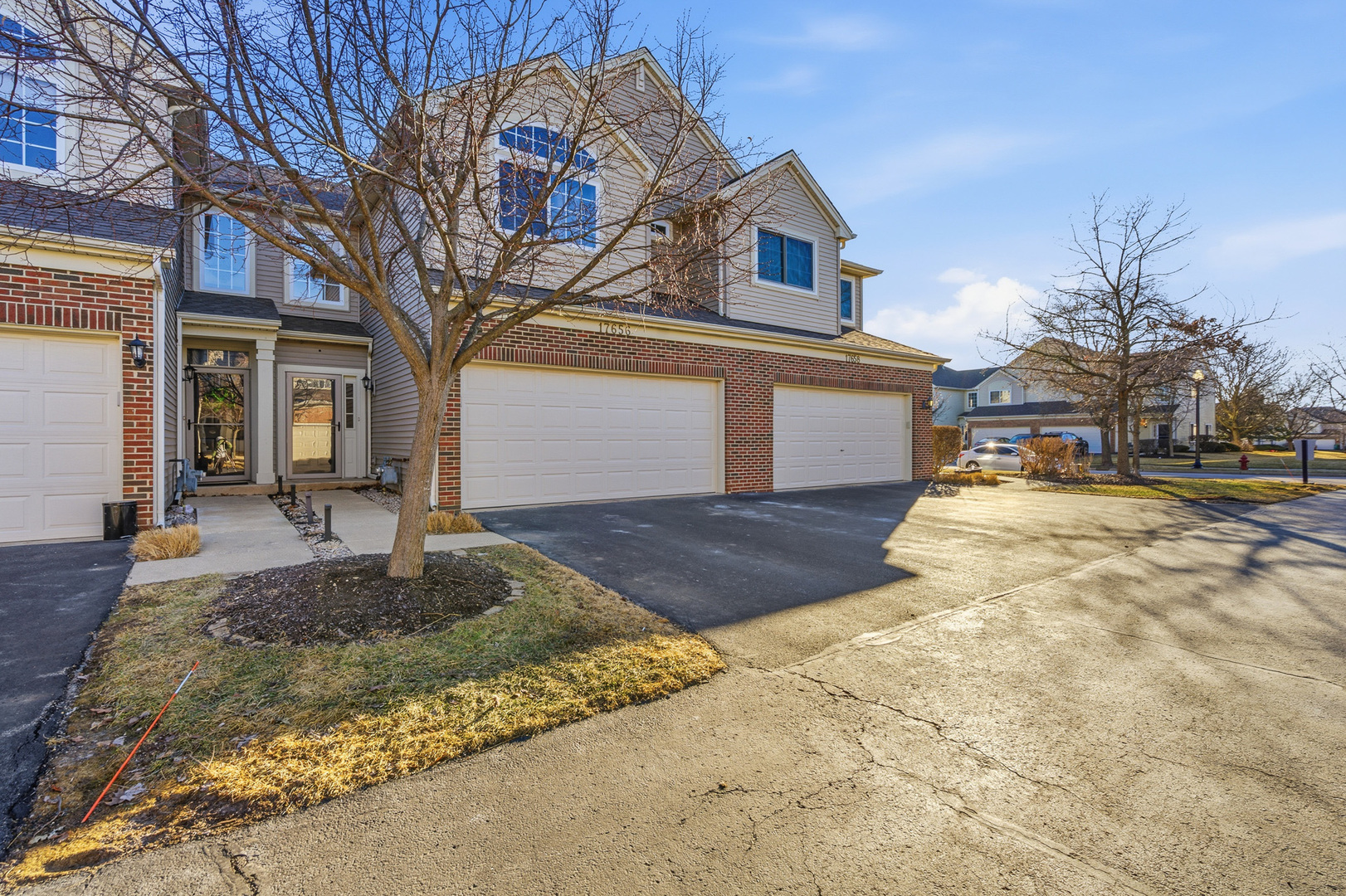 17656 Gilbert Drive Lockport, IL 60441 - Photo 25 of 32 a front view of a house with a yard and garage