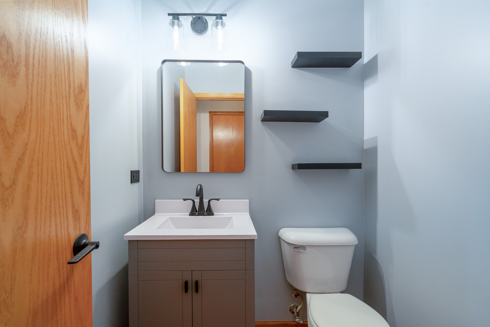 17656 Gilbert Drive Lockport, IL 60441 - Photo 8 of 32 a bathroom with a toilet sink and mirror