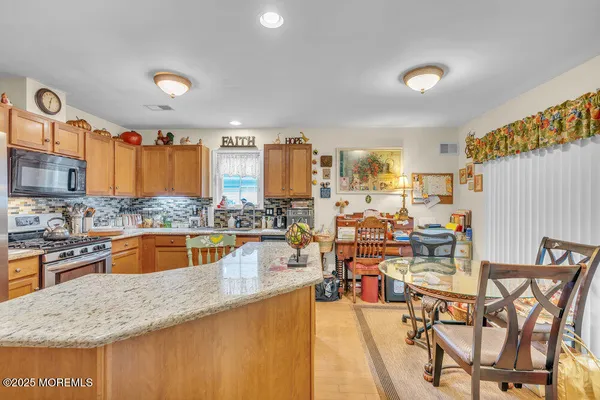a kitchen with lots of counter top space and stainless steel appliances