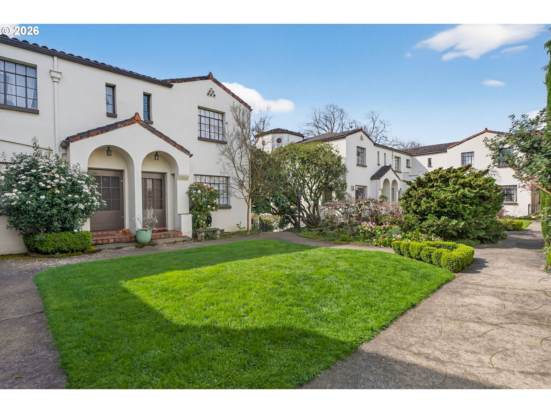 a front view of a house with garden