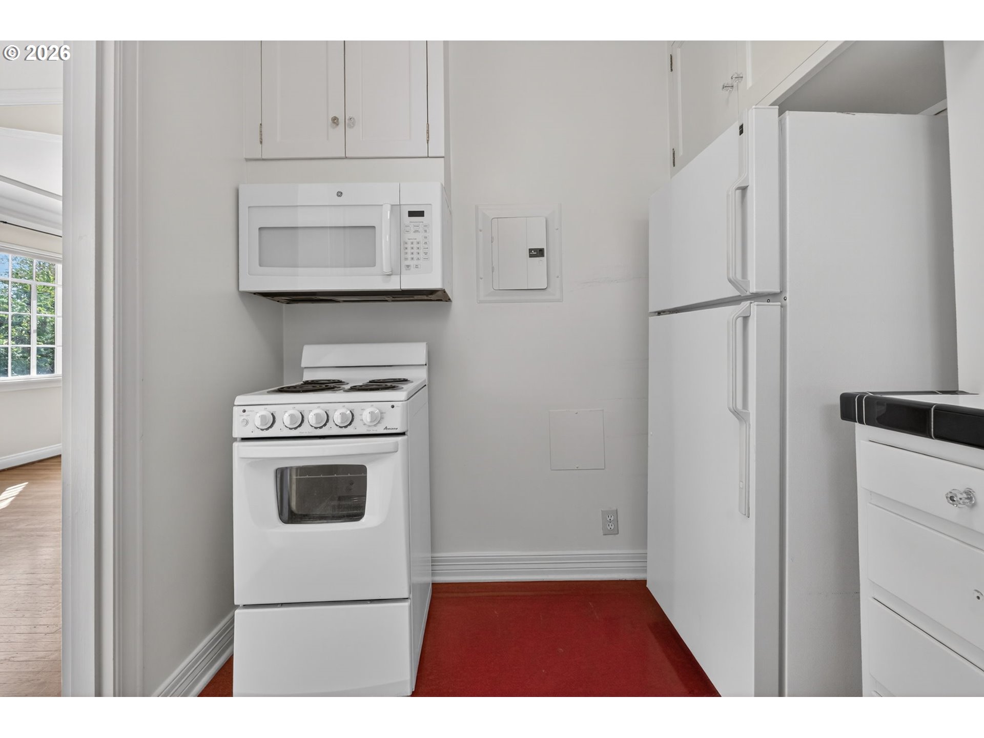 2325 Northeast Flanders Street, Unit 8 Portland, OR 97232 - Photo 15 of 42 a kitchen with white cabinets and white appliances