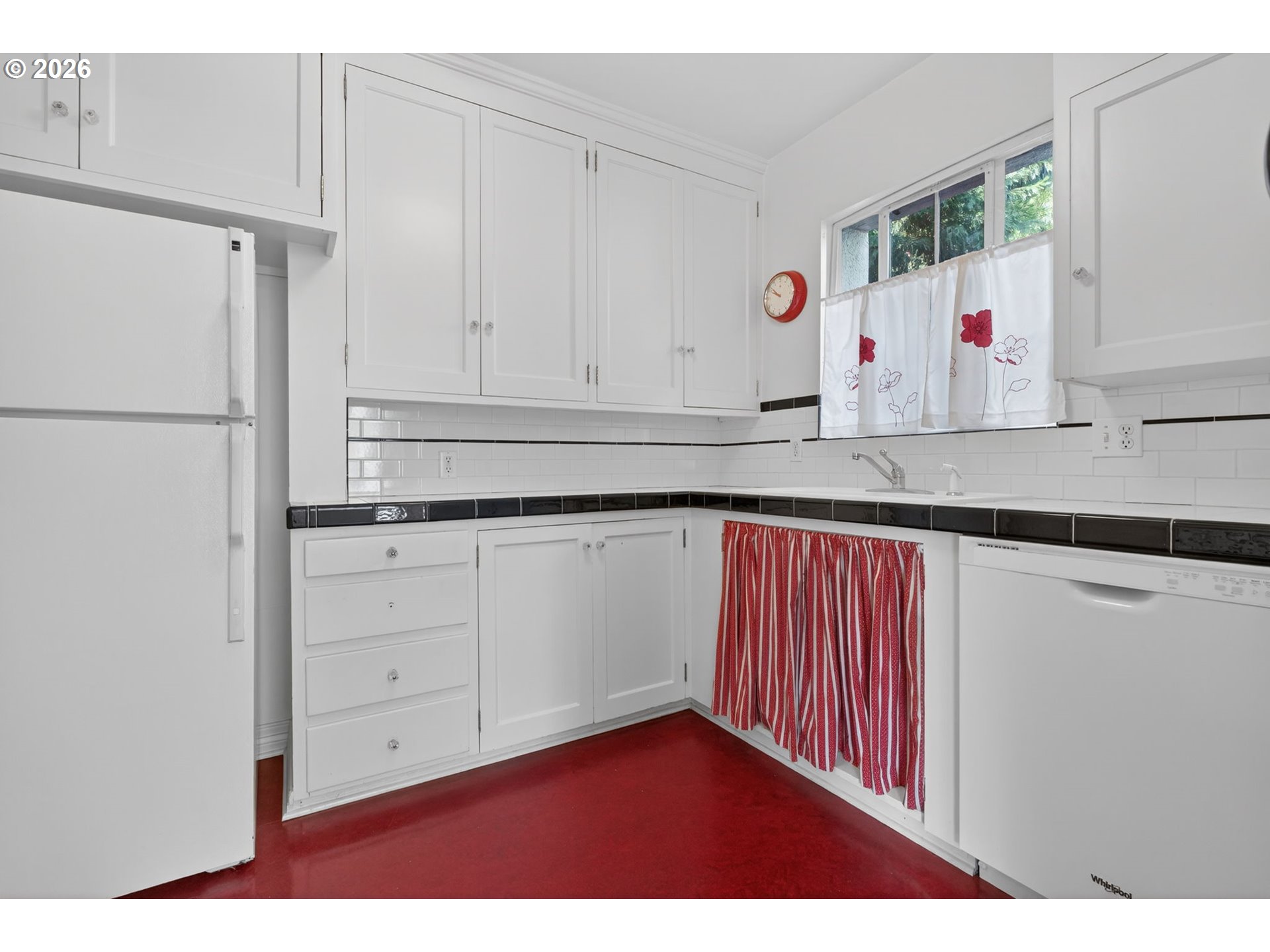 2325 Northeast Flanders Street, Unit 8 Portland, OR 97232 - Photo 16 of 42 a kitchen with cabinets appliances and a sink