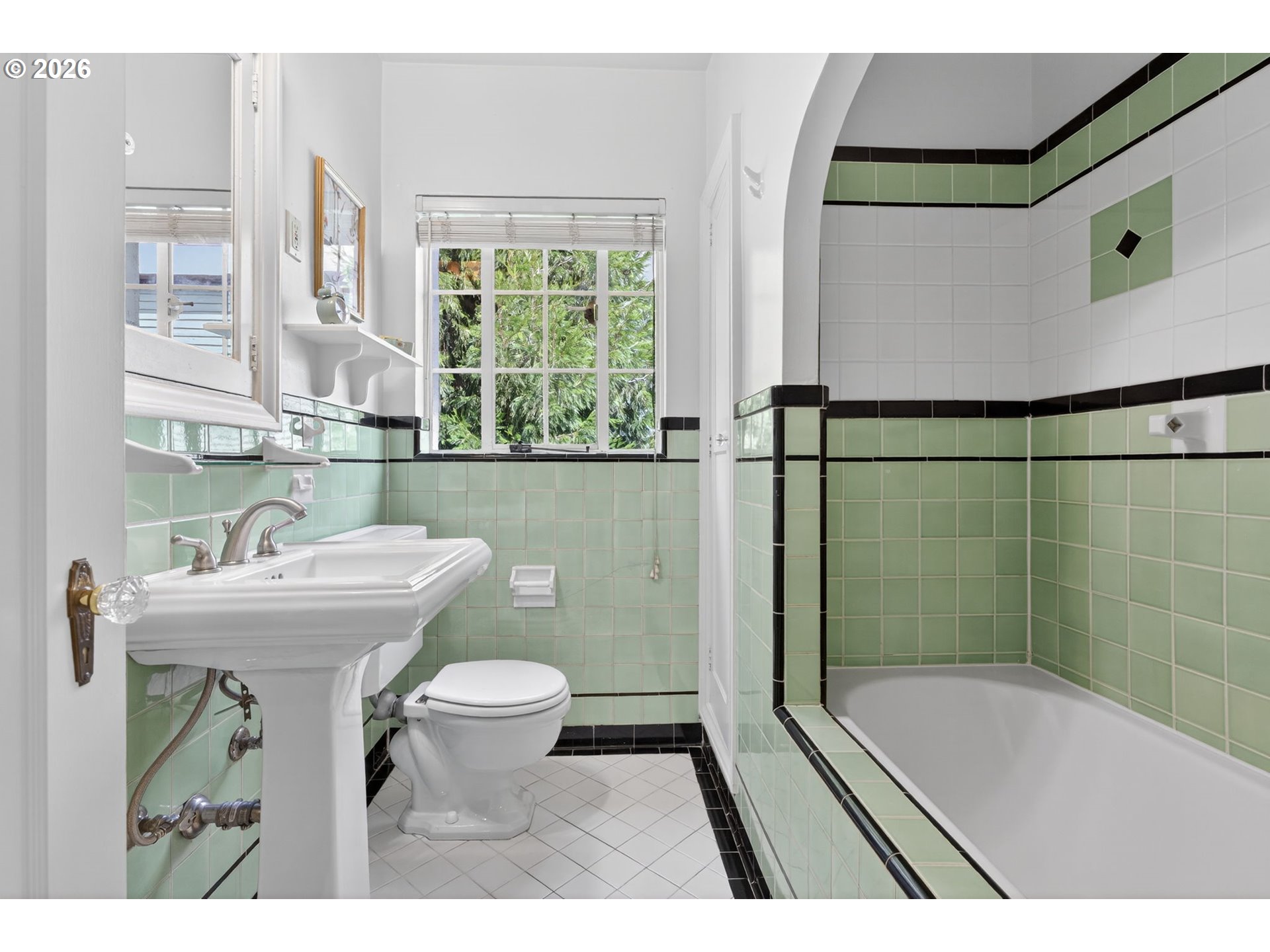 2325 Northeast Flanders Street, Unit 8 Portland, OR 97232 - Photo 19 of 42 a bathroom with a sink a toilet and a bathtub