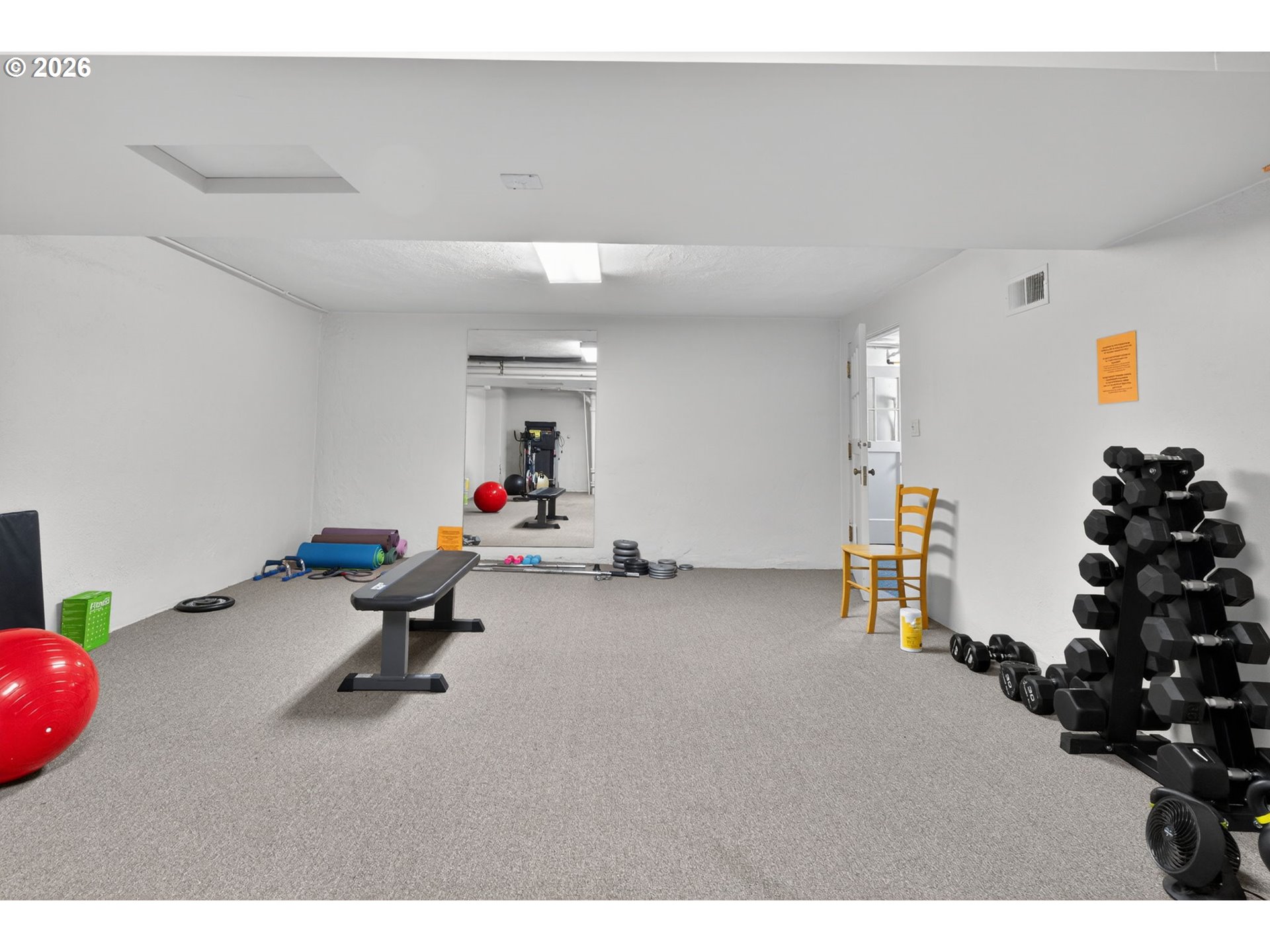 2325 Northeast Flanders Street, Unit 8 Portland, OR 97232 - Photo 27 of 42 a living room with furniture and gym equipment