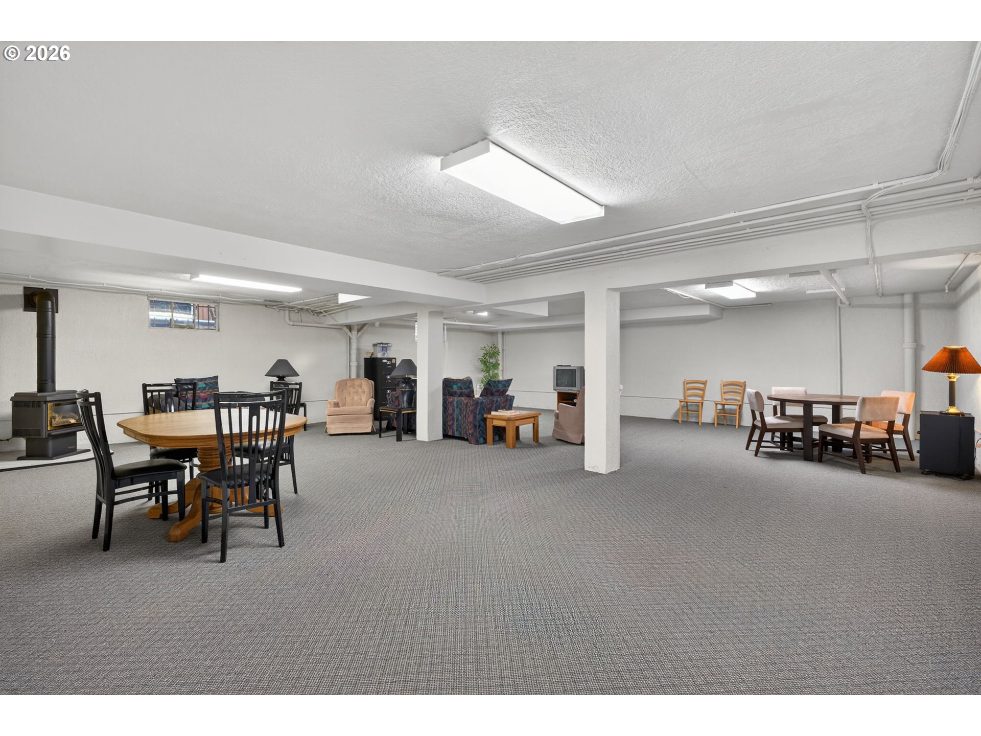2325 Northeast Flanders Street, Unit 8 Portland, OR 97232 - Photo 29 of 42 a view of a room with furniture and lots of windows