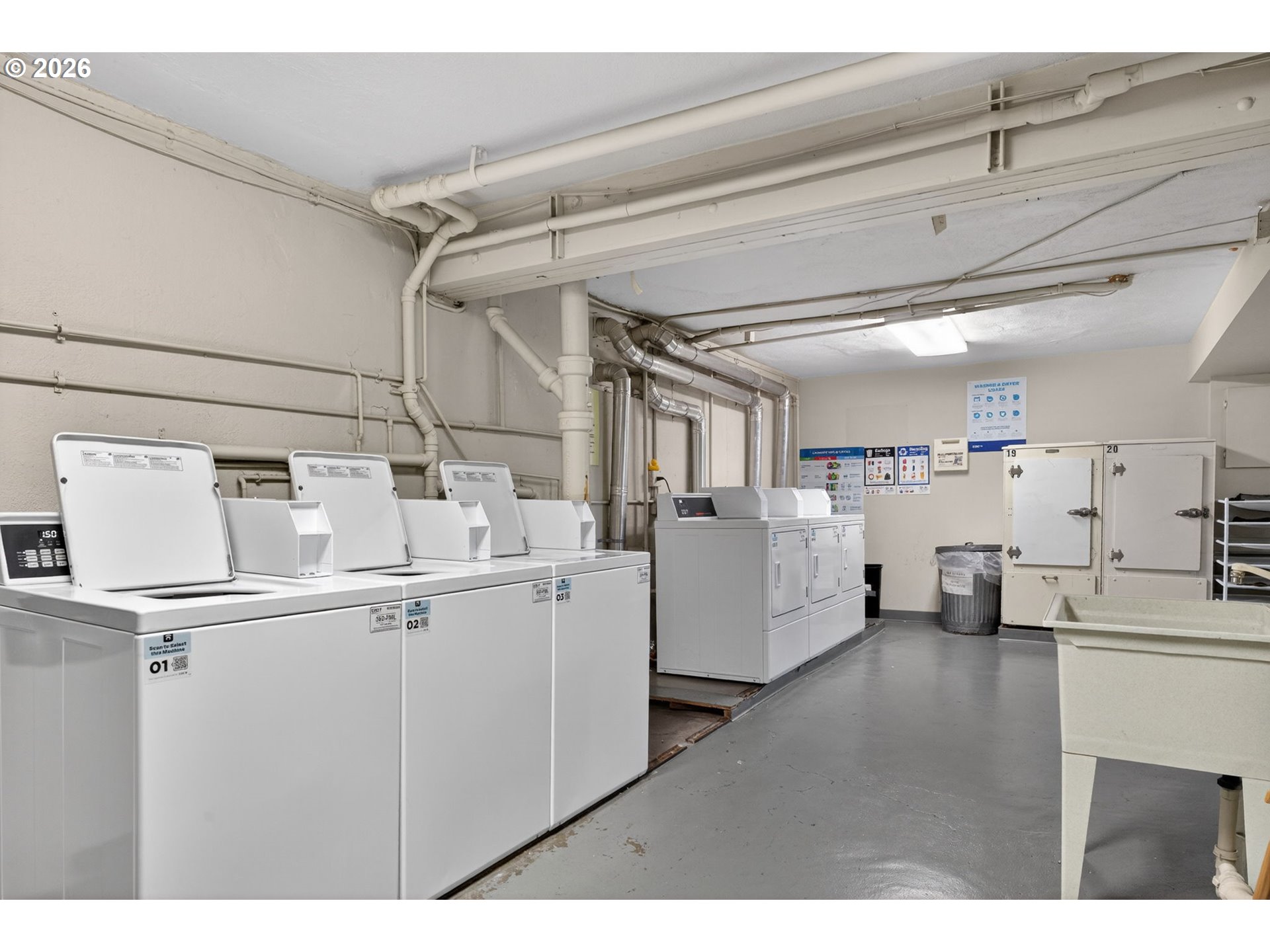2325 Northeast Flanders Street, Unit 8 Portland, OR 97232 - Photo 32 of 42 a utility room with cabinets