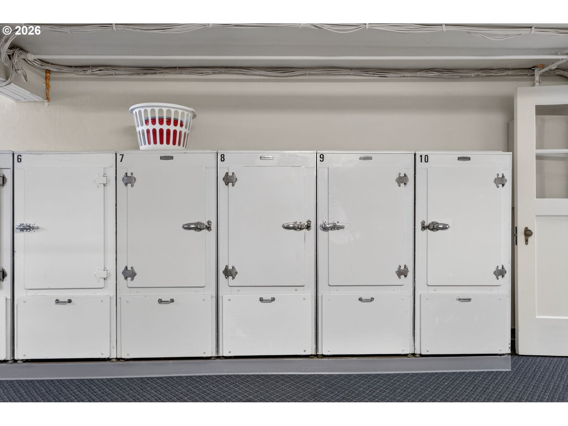 2325 Northeast Flanders Street, Unit 8 Portland, OR 97232 - Photo 33 of 42 a utility room with cabinets and wooden floor