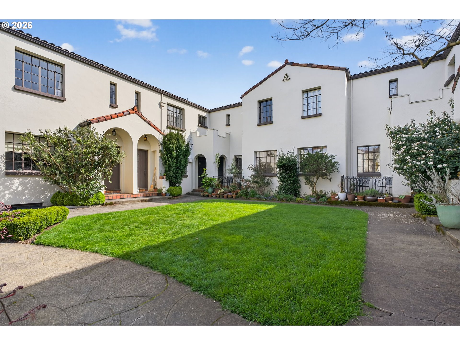 2325 Northeast Flanders Street, Unit 8 Portland, OR 97232 - Photo 39 of 42 a front view of a house with a yard and garage