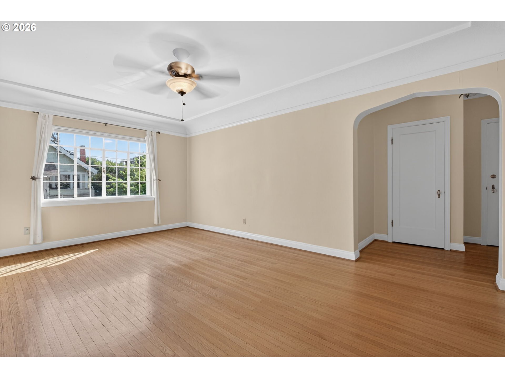 2325 Northeast Flanders Street, Unit 8 Portland, OR 97232 - Photo 5 of 42 wooden floor in an empty room with a window