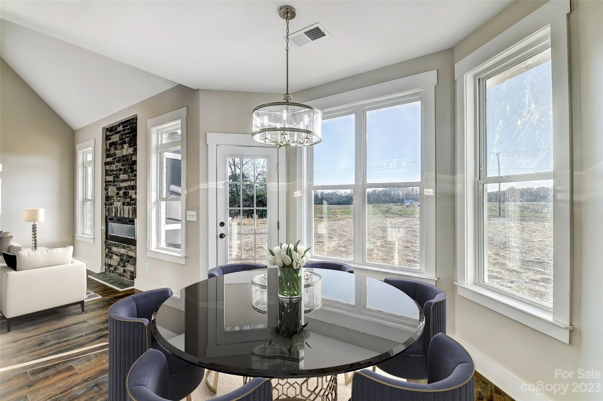 4308 White Tail Lane Midland, NC 28107 - Photo 16 of 37 a dining room with furniture a chandelier and wooden floor