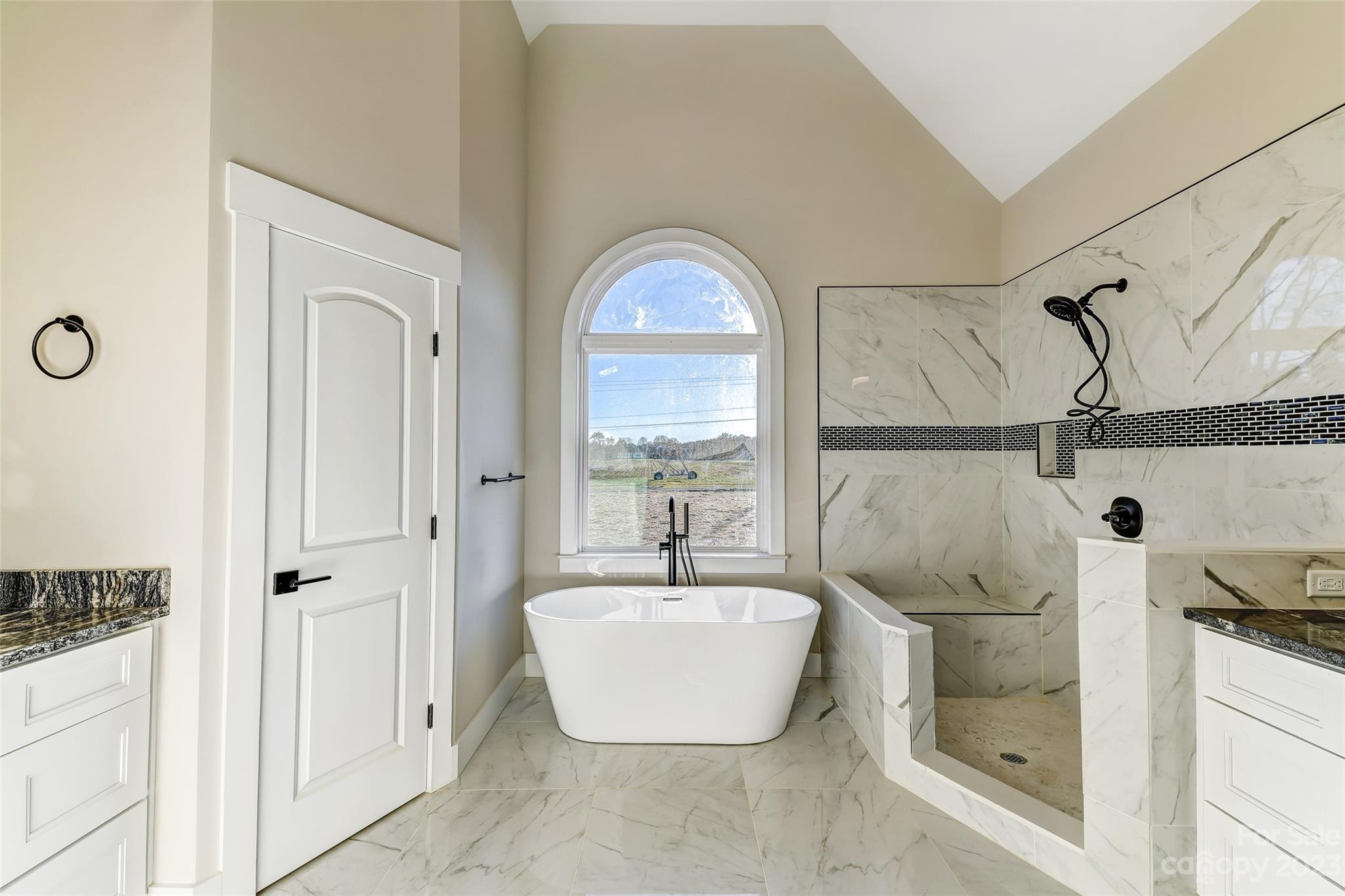 4308 White Tail Lane Midland, NC 28107 - Photo 23 of 37 a bathroom with a sink and mirror with bathtub