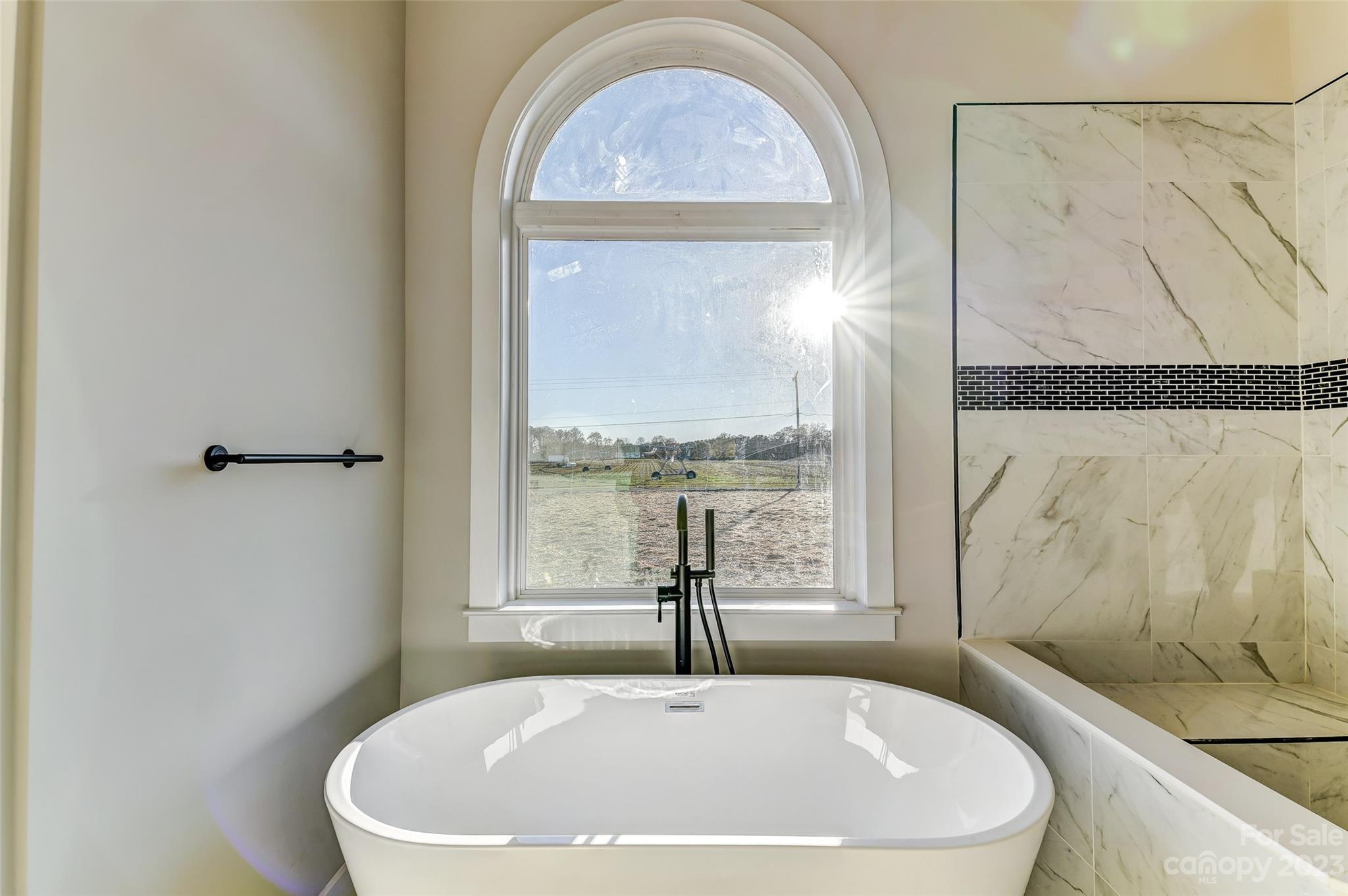 4308 White Tail Lane Midland, NC 28107 - Photo 26 of 37 a white bath tub sitting next to a window